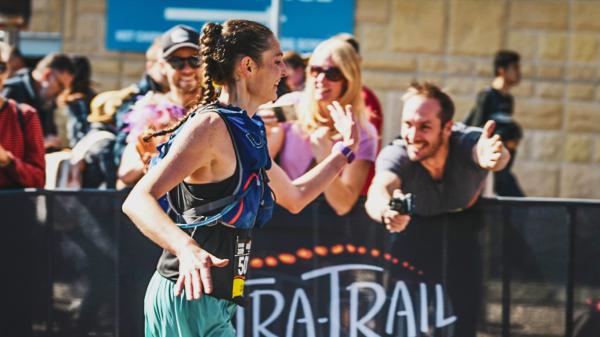 spectators high five finisher smiles